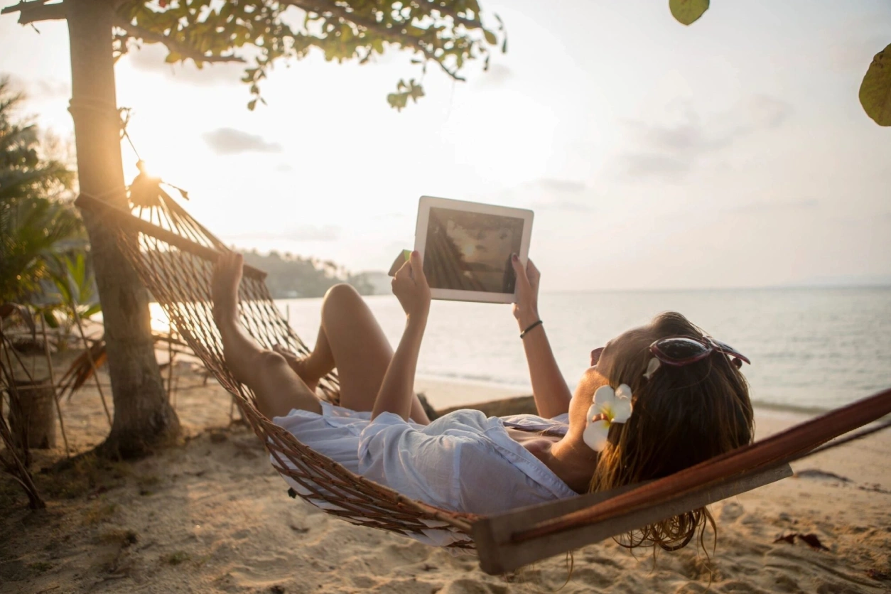 a woman watching tablet and relaxing