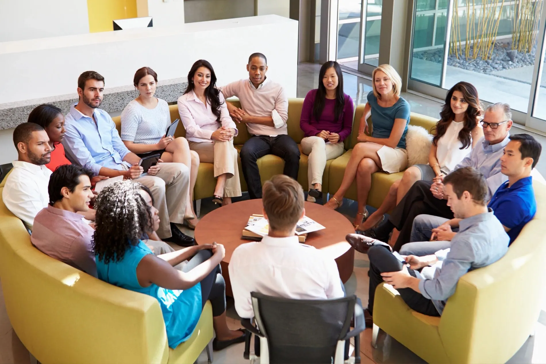 a group of people sitting on sofa